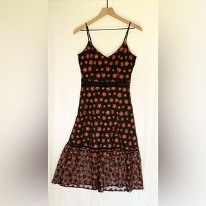Lulu’s black midi dress with red embroidered flowers and tulle overlay